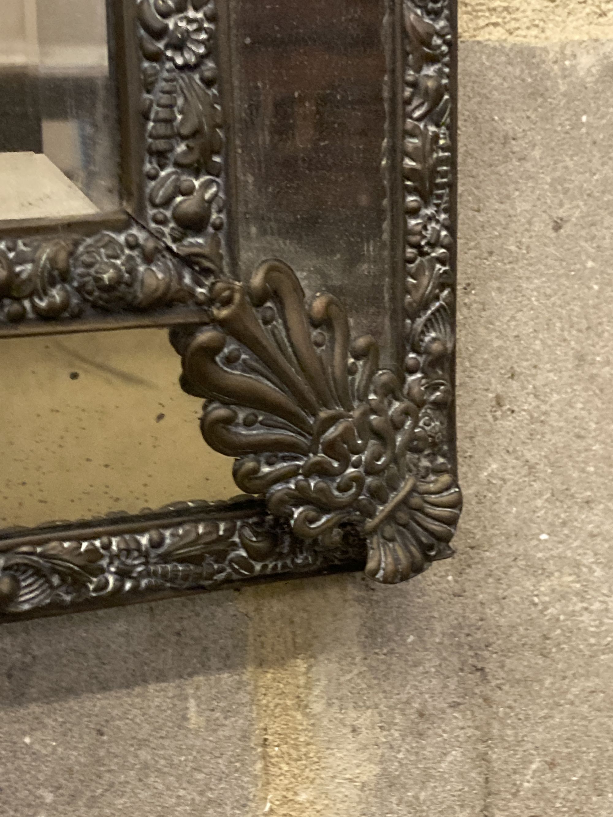 A 19th century French embossed brass wall mirror, width 33cm, height 54cm